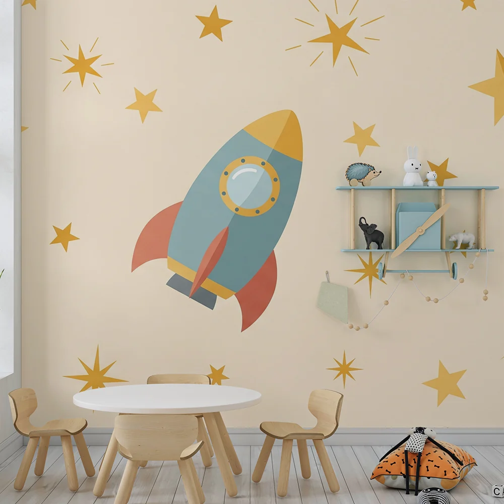 Papel de parede crianç | Foguete colorido e estrelas douradas em fundo suave